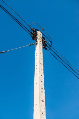 Electrical pole with wire on blue sky, Thailand