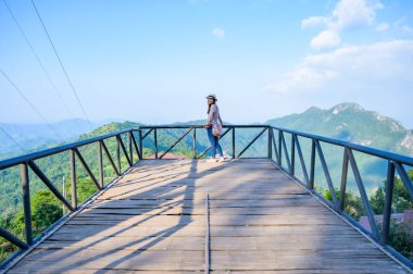 A female tourist on viewpoint platform at Pha Hi village, Chiang Rai Province.