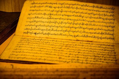 CHIANG MAI, THAILAND - February 11, 2021 : Lanna Alphabet in Ancient Book, Chiang Mai Province.