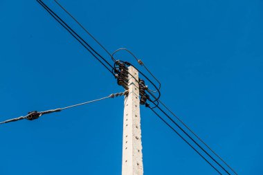 Electrical pole with wire on blue sky, Thailand