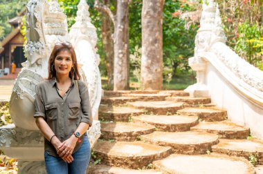 Thai woman with Thai style stair at Luang Khun Win temple, Chiang Mai Province.