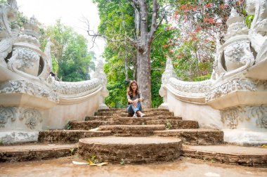 Thai woman with Thai style stair at Luang Khun Win temple, Chiang Mai Province.