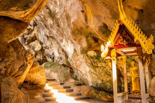 Phra Sabai cave with golden Buddha in Lampang province, Thailand.