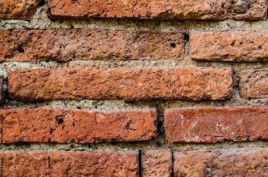 Tayland 'daki kırmızı tuğla duvarın arka planı.