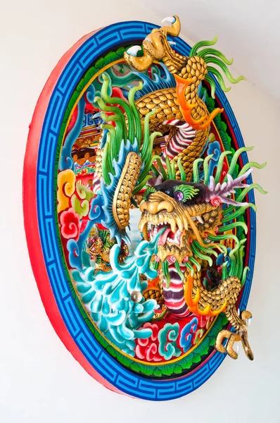 Dragon molding art on the wall, Thailand.