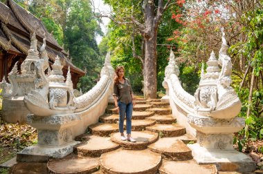 Thai woman with Thai style stair at Luang Khun Win temple, Chiang Mai Province.