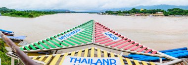 CHIANG RAI, THAILAND - July 18, 2020 :  The Sign of Golden Triangle with Mekong River View at Chiang Saen District, Chiang Rai Province.