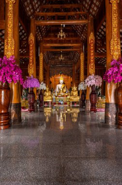 White Buddha statue in Ban Den temple, Chiang Mai province.