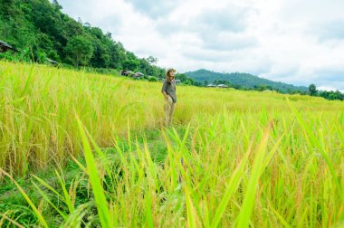 Asian Woman with Pa Bong Piang Rice Terraces at Chiang Mai Province, Thailand.