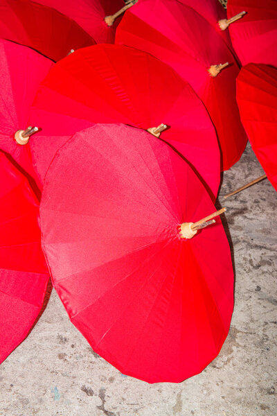 Red umbrellas at umbrella factory, Thailand