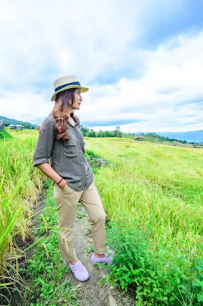 Asian Woman with Pa Bong Piang Rice Terraces at Chiang Mai Province, Thailand.