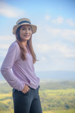 Thai Woman at Pha Hua Reua Viewpoint in Phayao Province, Thailand.
