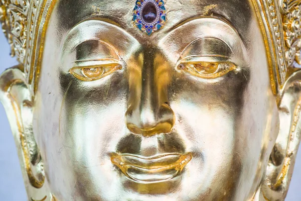 Face of golden buddha sculpture, Thailand