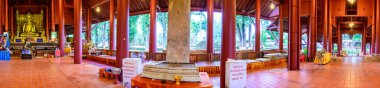 CHIANG RAI, THAILAND - July 18, 2020 :  Panorama View of Ancient Buddha Statue with Lanna Style Building in Wat Chedi Luang, Chiang Rai Province.