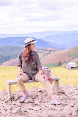 Asian Woman with Rice Field Background at Pa Bong Piang Rice Terraces, Chiangmai Province.