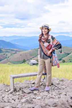 Asian Woman with Rice Field Background at Pa Bong Piang Rice Terraces, Chiangmai Province.