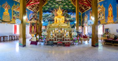 NAN, THAILAND - November 5, 2020 : Panorama View of Old Buddha Statue with Thai Style Church in Prang Temple, Nan Province.