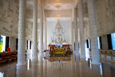White Buddha statue in Hyuaplakang temple, Thailand. clipart