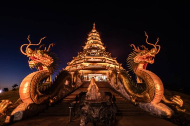 Beautiful Chinese pagoda in the night at Hyuaplakang temple, Thailand. clipart