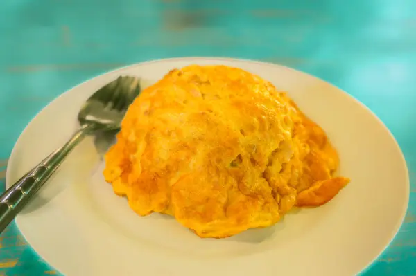 stock image Minced pork omelette with rice on a plate. Thai pork omelette with rice. Thai traditional omelets with minced pork on streamed rice.