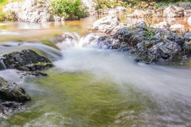 Water Flowing in Khlong Lan Waterfall, Thailand clipart