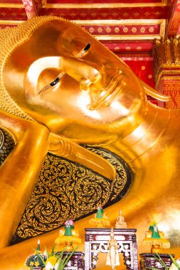 Reclining Buddha at Pamok Temple, Thailand. clipart