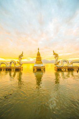 White Naga statue at Kwan Phayao, Thailand. clipart