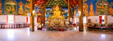 NAN, THAILAND - November 5, 2020 : Panorama View of Old Buddha Statue with Thai Style Church in Prang Temple, Nan Province.