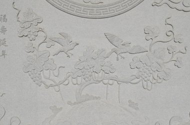 Duvardaki Çin oyma sanatı granitten yapılmış, Tayland.