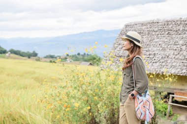 Asian Woman with Pa Bong Piang Rice Terraces at Chiang Mai Province, Thailand.