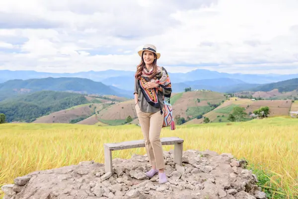 Asian Woman with Rice Field Background at Pa Bong Piang Rice Terraces, Chiangmai Province.
