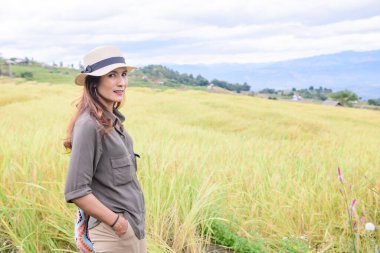 Asian Woman with Pa Bong Piang Rice Terraces at Chiang Mai Province, Thailand.