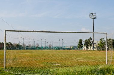 Futbol golü ve yeşil alan, Tayland.