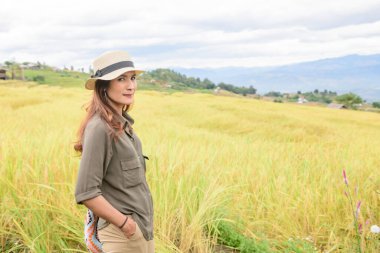 Asian Woman with Pa Bong Piang Rice Terraces at Chiang Mai Province, Thailand.