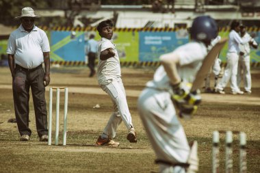 Boys play cricket in Mumbai_India, by Pascal Kehl