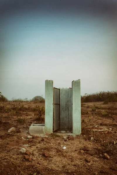 Toilet in the middle of an arid landscape in north-east India, by Pascal Kehl