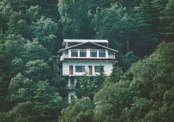 Image of House in Hills between the trees