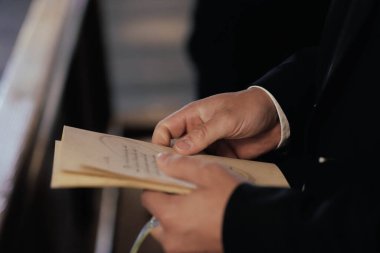 church bible paper in hands