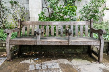 Empty bench at St. Dunstan-in-the-East garden, a church that was bombed during  the Second World War and the ruins are now a public garden in the City of London.