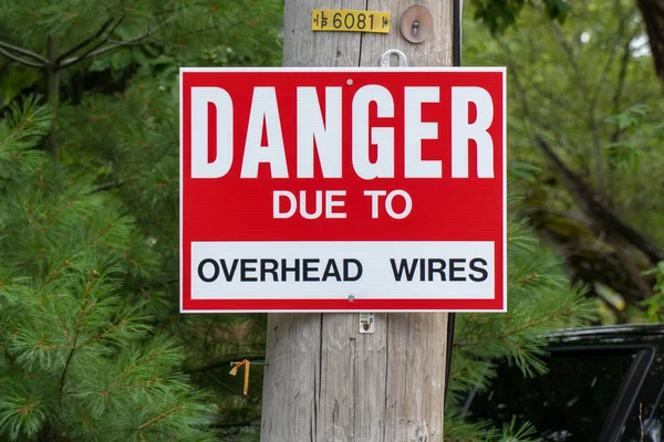 Danger due to overhead wires sign