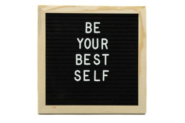 Be your best self sign on black background, wood frame on white background