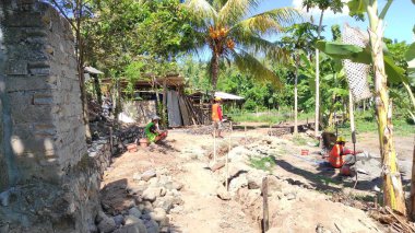 the ruins of the old town of the island of the dead sea in the background