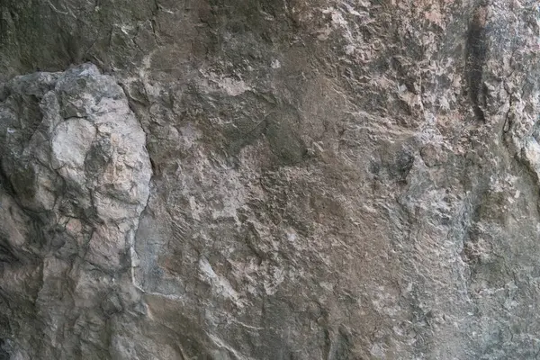 Taş zemin eşsiz pürüzlü bir yüzeye ve açık renge sahiptir. Arkaplan ve doku için.