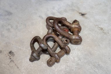 Old rust chain links isolated on the concrete background