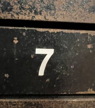 number 9 written on a wall