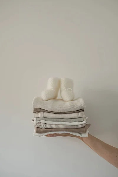 Person Hand Hold Stack Stylish Elegant Newborn Baby Clothes Socks — Stock Photo, Image