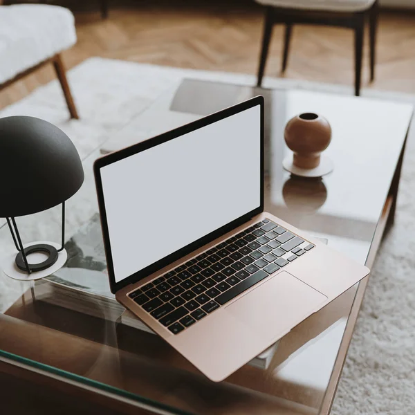 stock image Laptop computer with blank screen on table. Aesthetic influencer styled workspace interior design template with mockup copy space