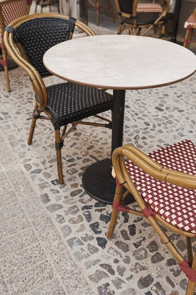 Cafe terrace. Outdoor restaurant table and chairs. Breakfast, dining concept