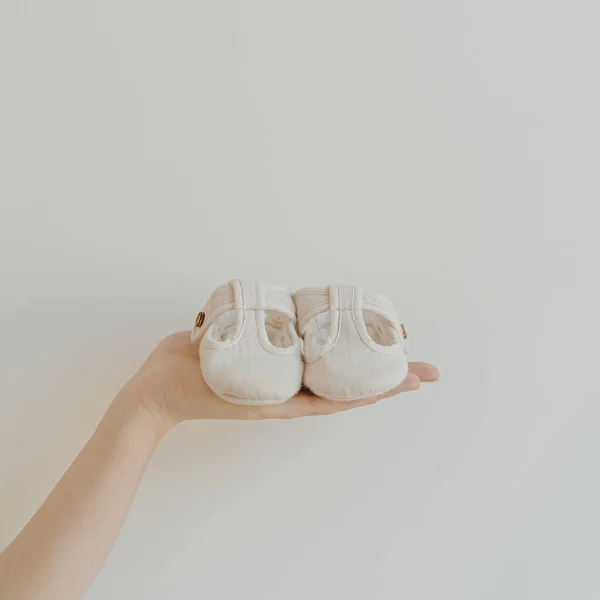 White Cotton Cute Baby Shoes Women Hand White Background Fashion — Stock Photo, Image