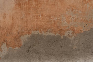 Grey and coral plaster facade texture. Abstract background pattern